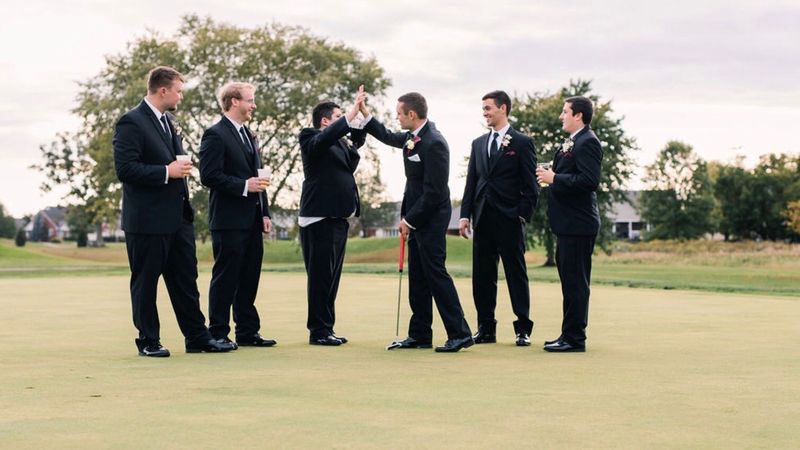 Groomsmen play golf